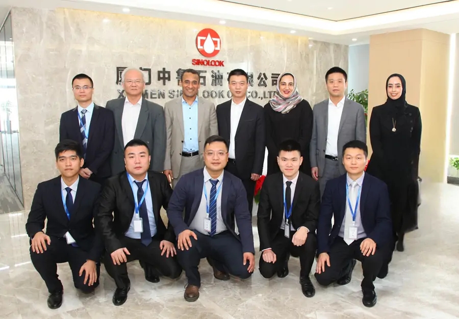 Delegation from Abu Dhabi National Oil Company (ADNOC) visiting Xiamen Sinolook Oil Co., Ltd in China to discuss exclusive base oil cooperation.